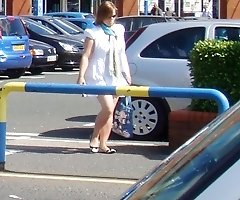 Girl in short skirt caught in street