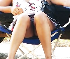 This chocolate babe is very hot. Up the skirt