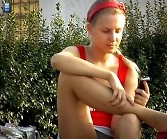 Voyeur upskirt pussy of blonde girl making a phone call
