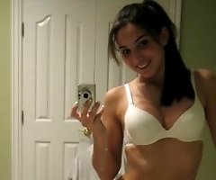 Babe in top and mini skirt erotically poses on home cam