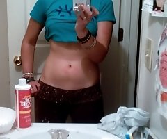 Lady gets naked and fools around in necklace