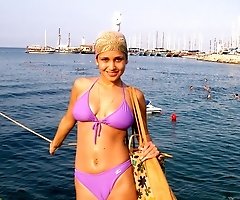 Warm waves washing bikini girl's sweet body