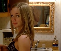 Provoking lady tightly pressing her natural boobs