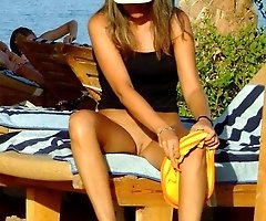 Women changes their pants on beach