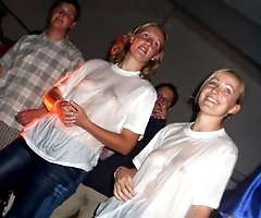 Their cloths are wet and sheer exposing nips