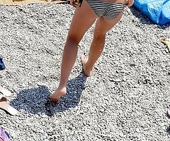 Girls in bikinis relax under sun