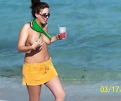 Bikini girls love getting sun tanned on the beach